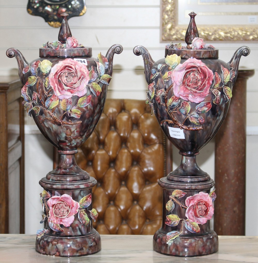 A pair of Italian floral encrusted pottery vases and covers, height 58cm